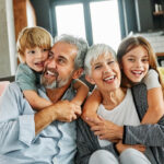 Grandparents and grandchildren having fun together at home