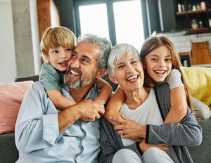 Grandparents and grandchildren having fun together at home